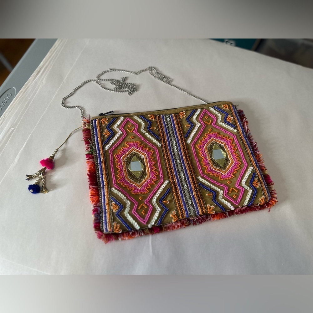 Bag embellished with beads mirrors and fringe